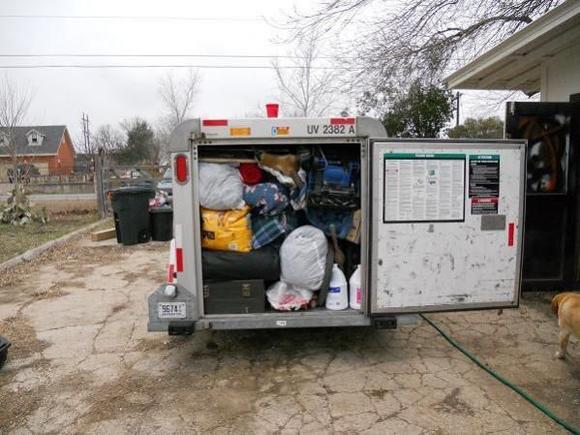 Packing up in TX.  We stuffed that little trailer!  4 X 4 X 12, I didn't dare go any bigger, the trailer pulled well and drafted good.  I would say we did 70~80 most of the way up.  Pulls it real good running 10 psi of boost!